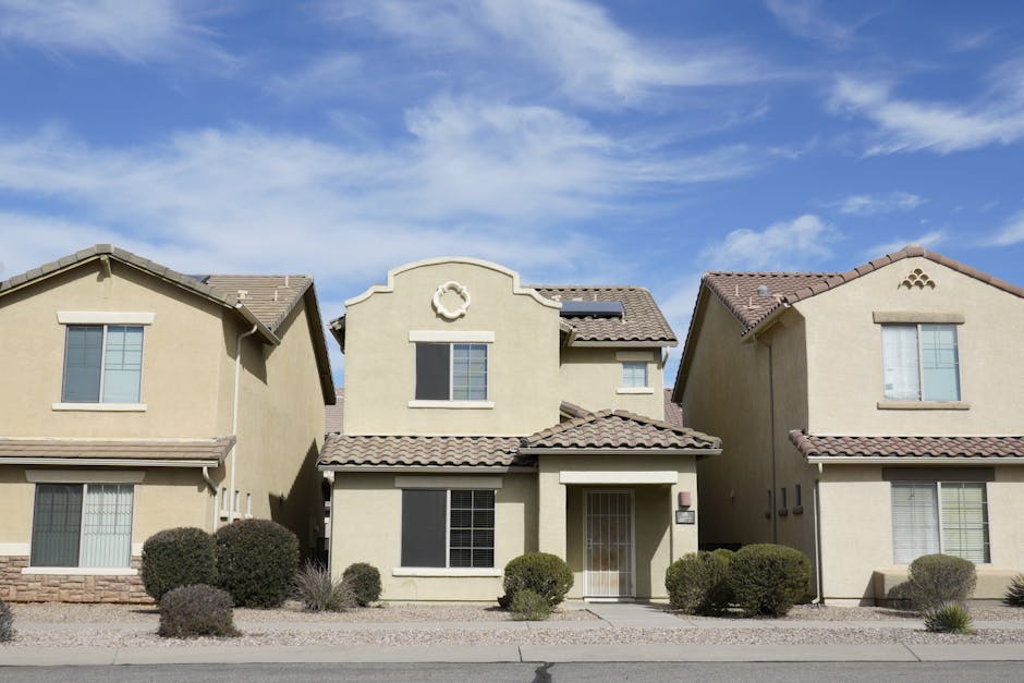 A quiet residential home exterior at golden hour.