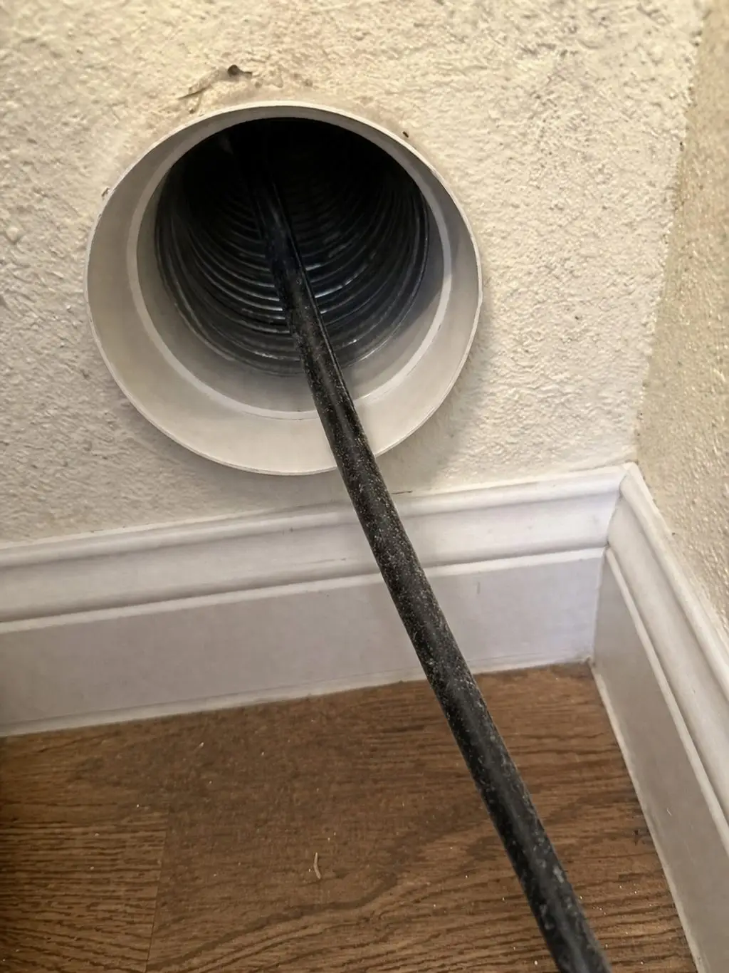 Dryer vent exterior cap cleared of lint buildup by Edgar's Service