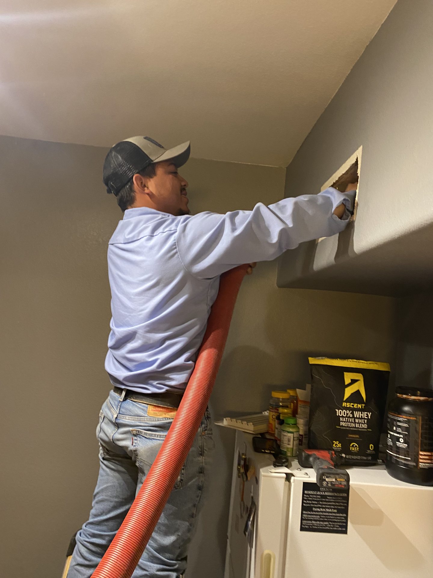 Edgar's Service technician performing residential air duct cleaning in Las Vegas